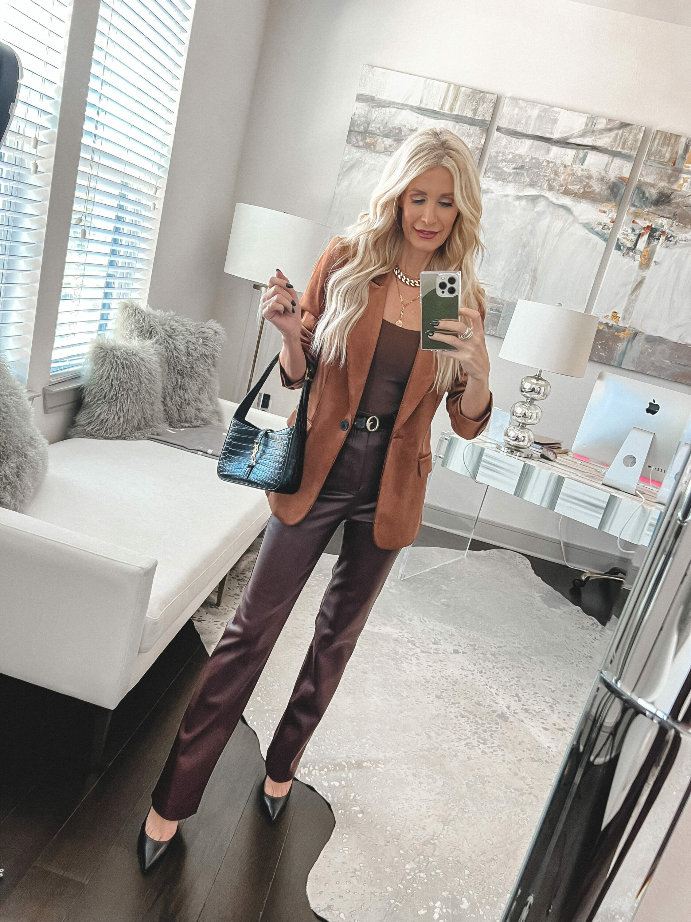 Over 40 fashion blogger wearing brown faux leather pants and a camel blazer and 2 of 7 must-have under $100 fall staples.