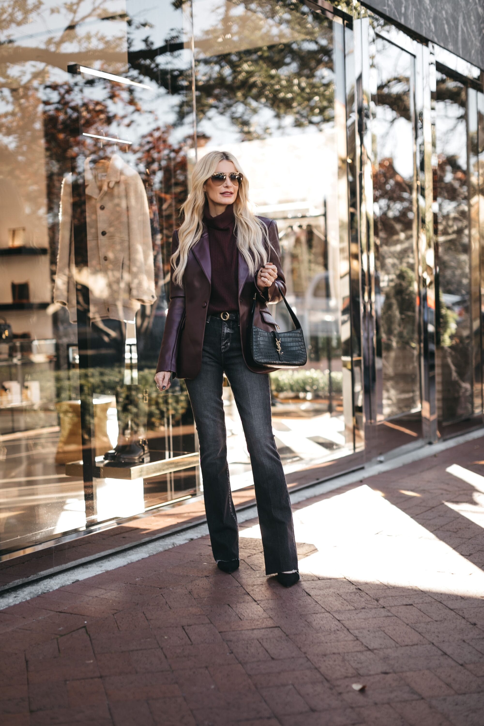 Dallas fashion blogger for women over 40 wearing one of 3 amazing fall jackets styled with dark wash straight leg jeans.