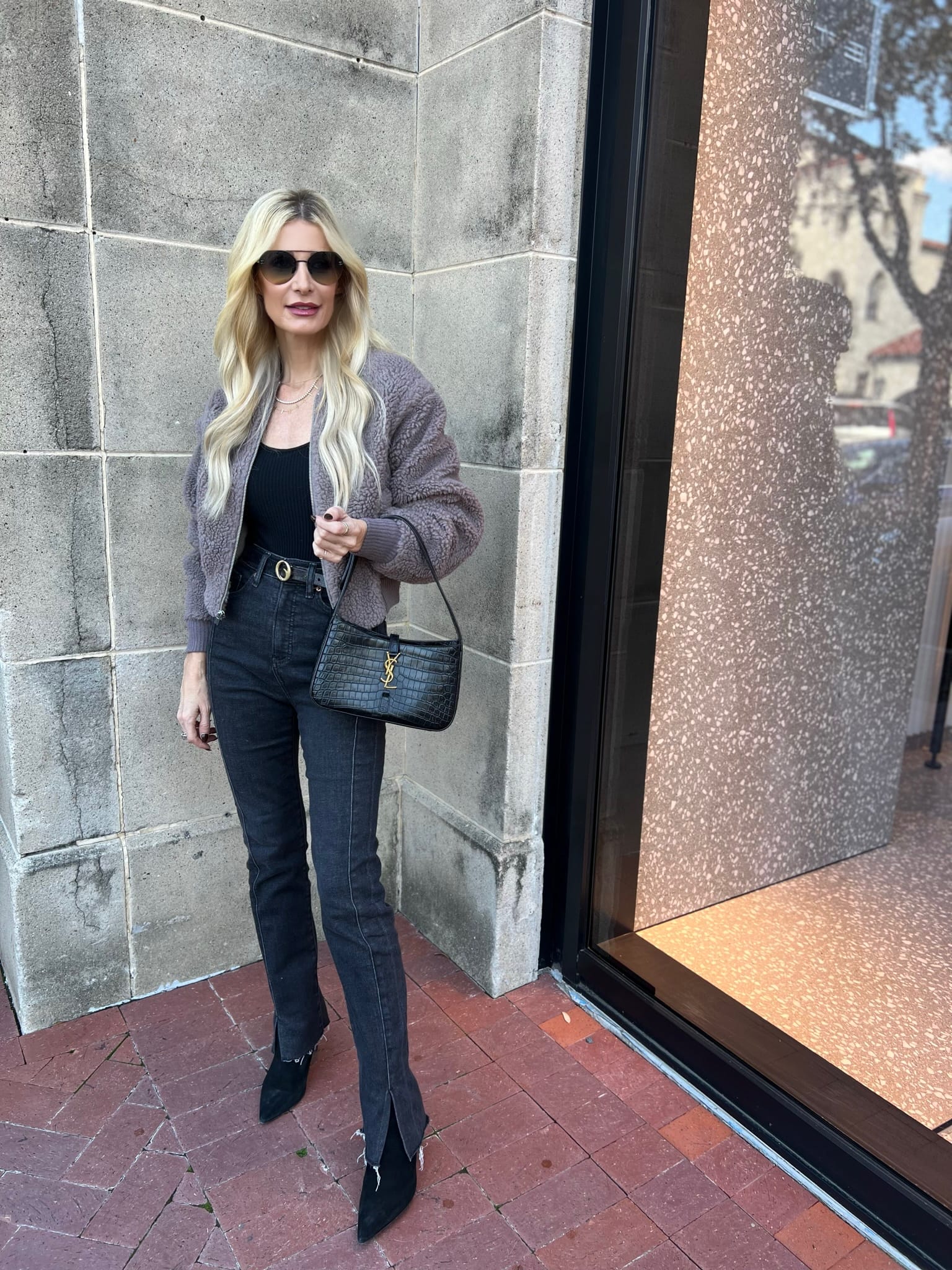 Over 40 fashion influencer wearing a faux fur bomber jacket as one of the Best Black Friday Sales of 2023.