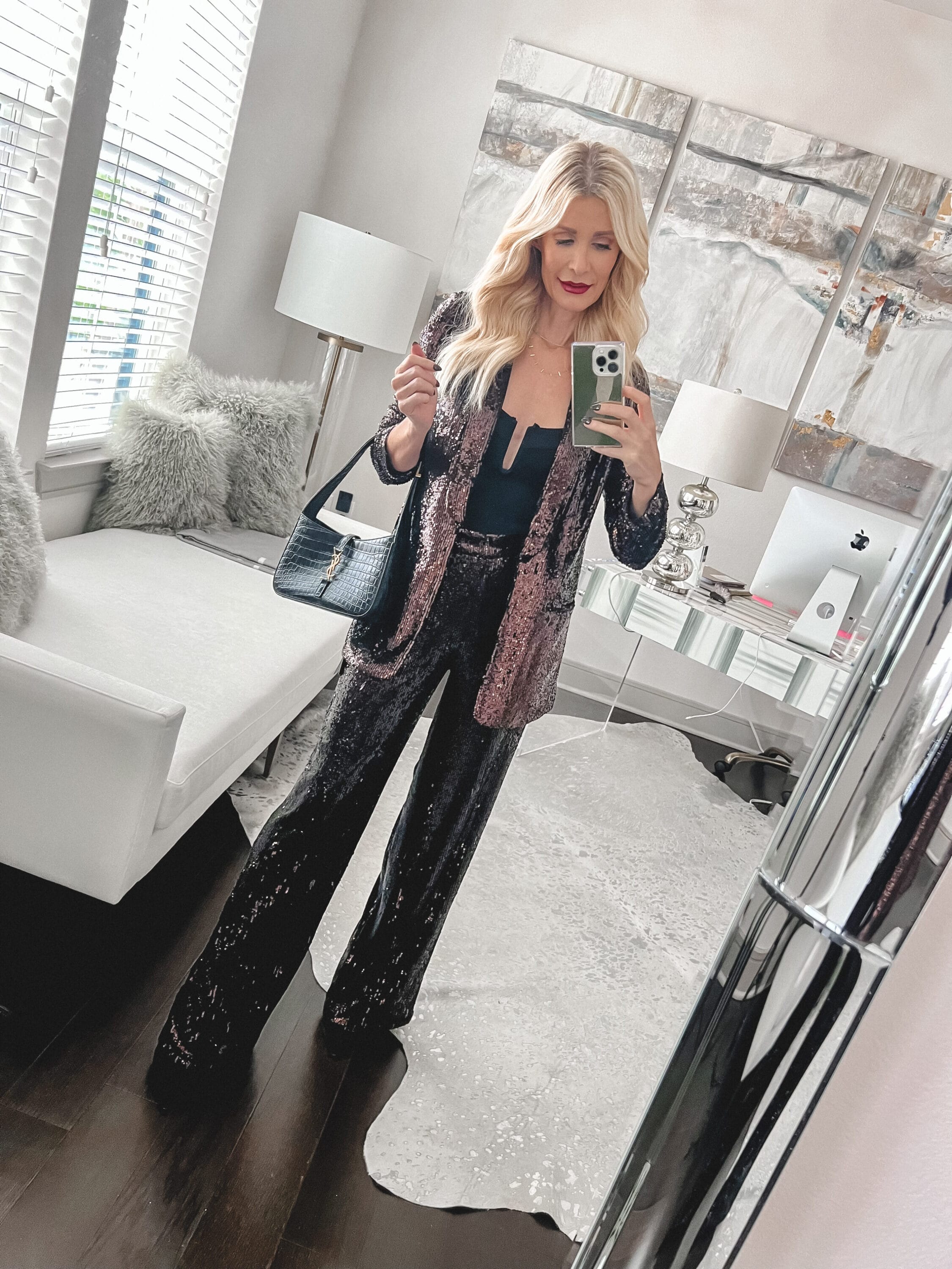 Dallas fashion influencer for women over 40 wearing a matching sequin set with a black bodysuit as an example of what to wear on New Year's Eve.