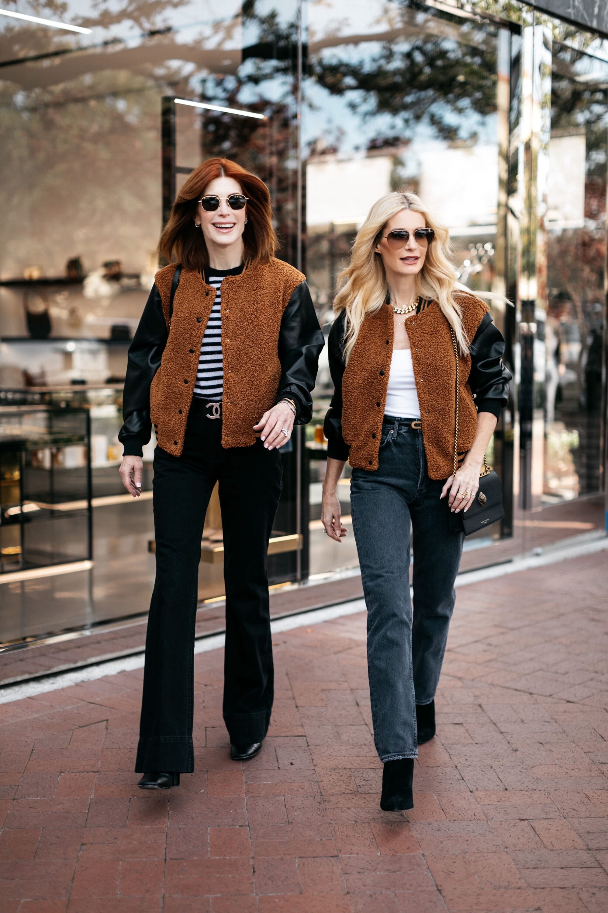 Ove 40 fashion influencers wearing camel & black varsity bomber jackets styled 2 ways.