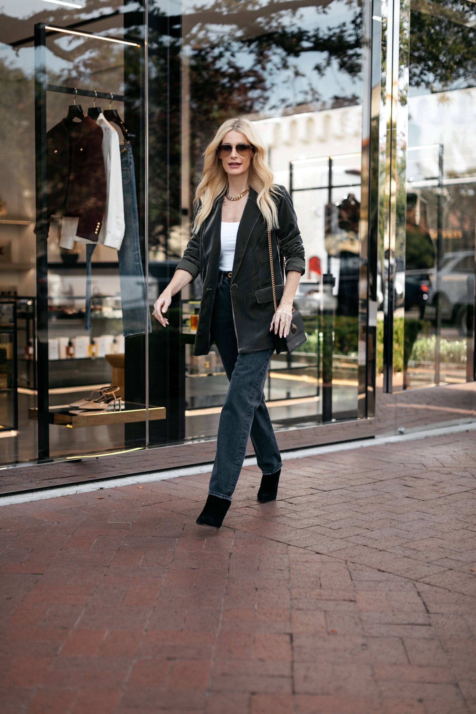 Dallas fashion icon for women over 50 show casing 5 looks featuring black denim.