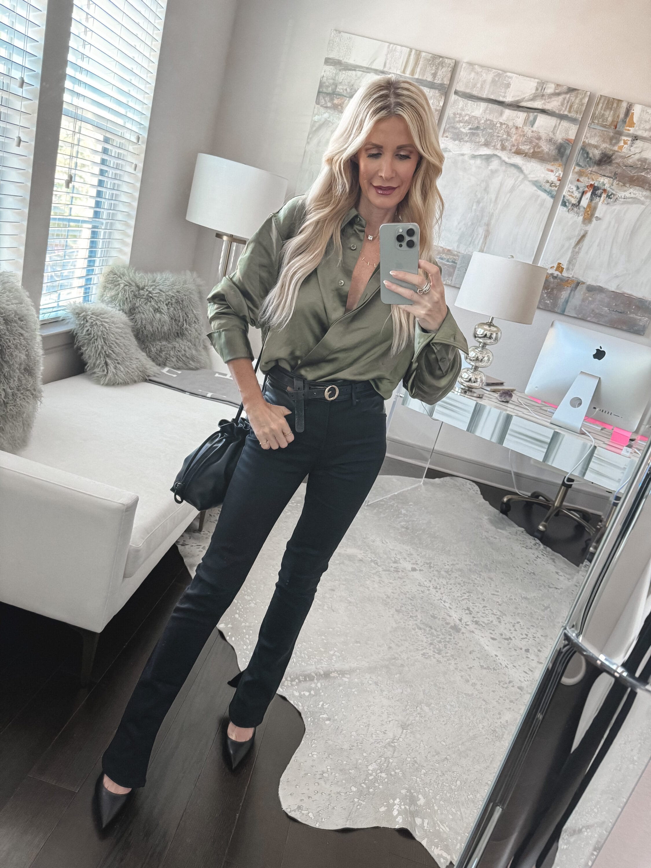 Over 40 fashion stylist from Dallas wearing black Express jeans with a green satin top as one of 5 ways to wear black jeans.