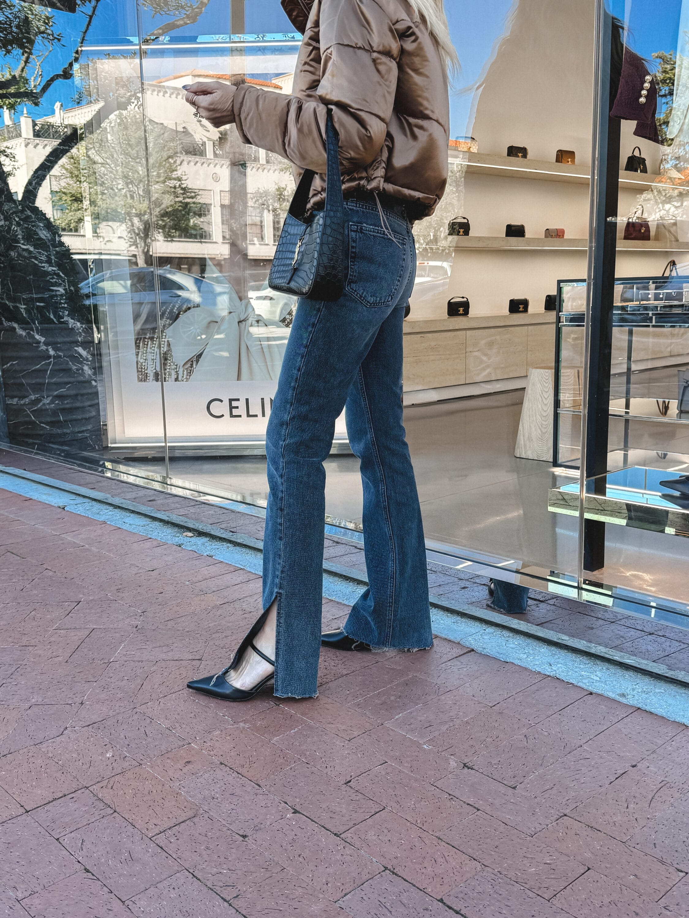 Over 40 Dallas fashion blogger waring Simkhai heels with split hem jeans and an under $100 jacket.