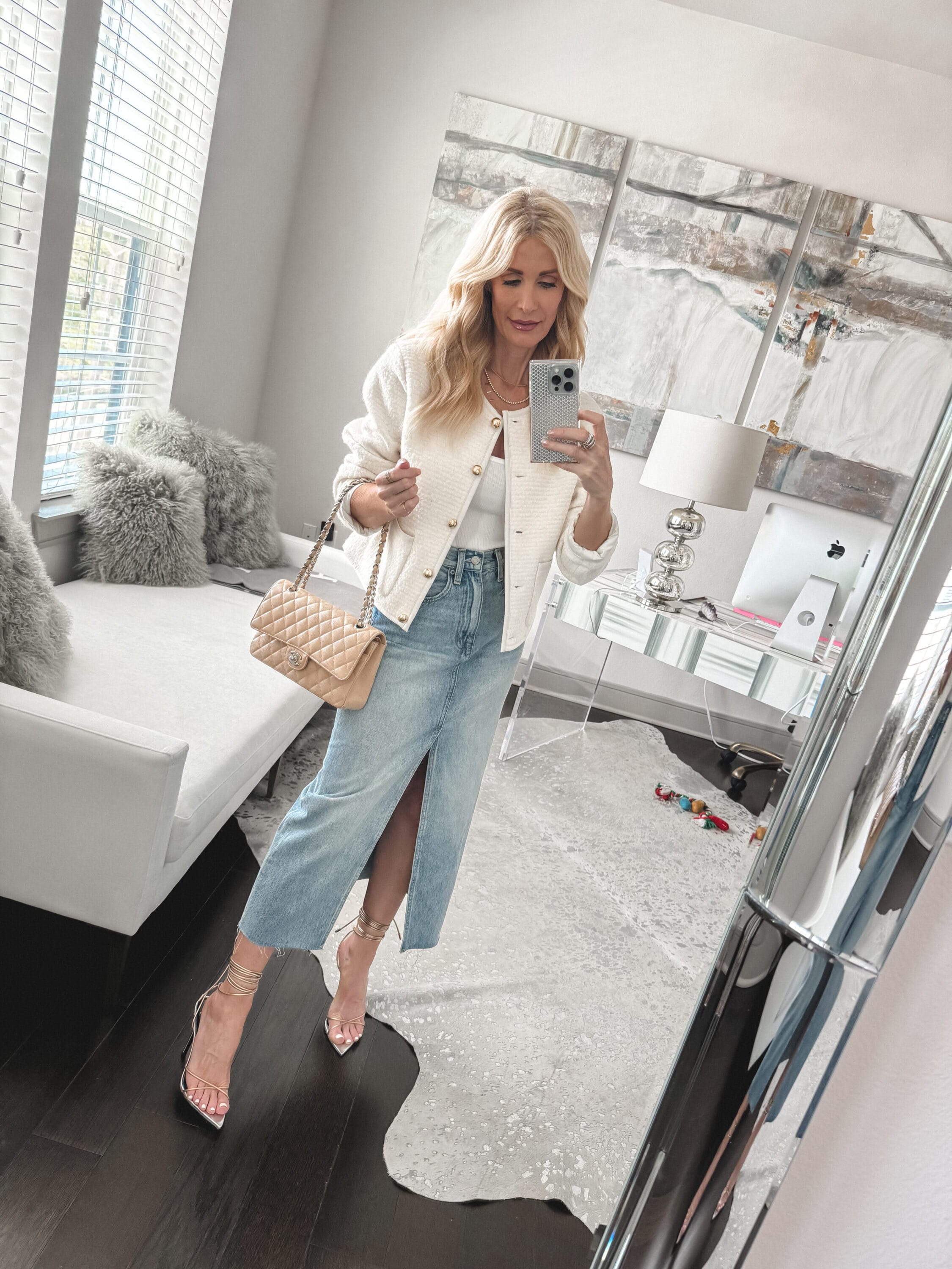 Dallas fashion influencer wearing a budget friendly version of a Chanel-inspired jacket and a denim midi skirt with gold & silver lace up heels.