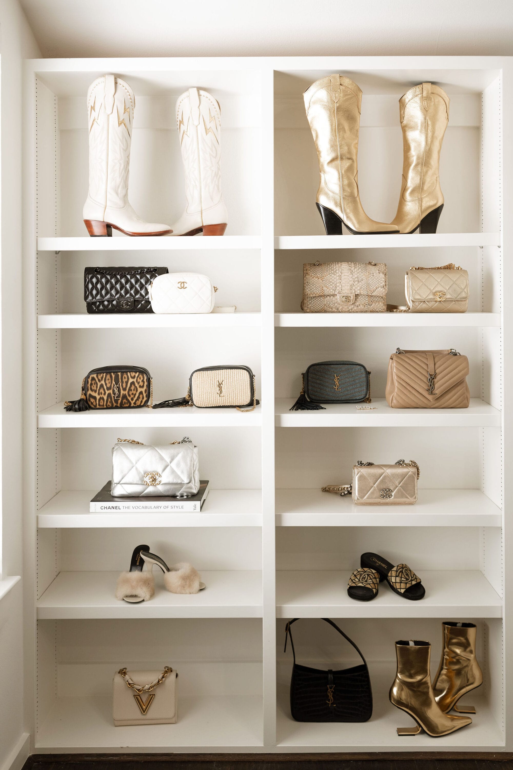 Open faced shelving with designer handbags, boot and shoes on display as part of Heather's home office decor