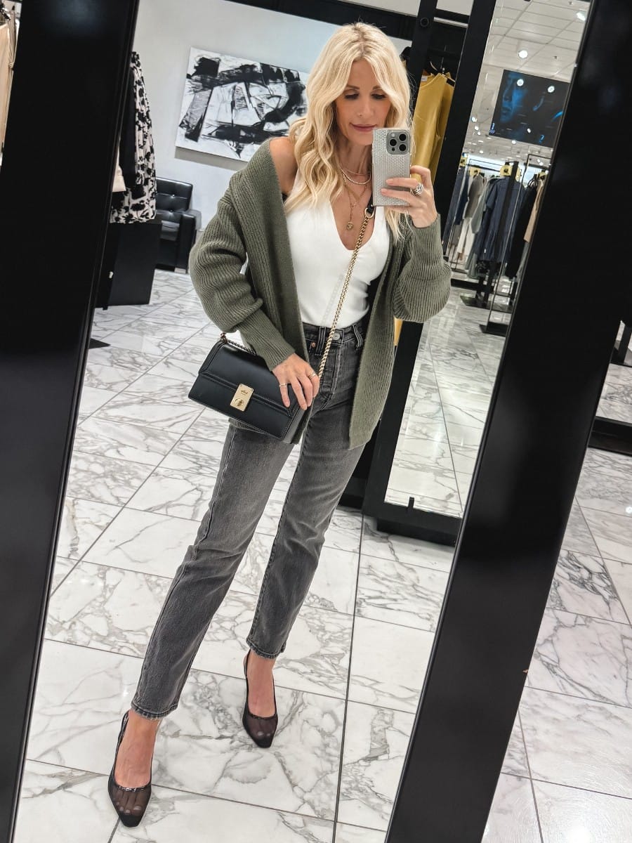 Dallas woman over 40 wearing a olive green cardigan over a white bodysuit with grey jeans as one of 10 stylish outfits from the Nordstrom Anniversary Sale.