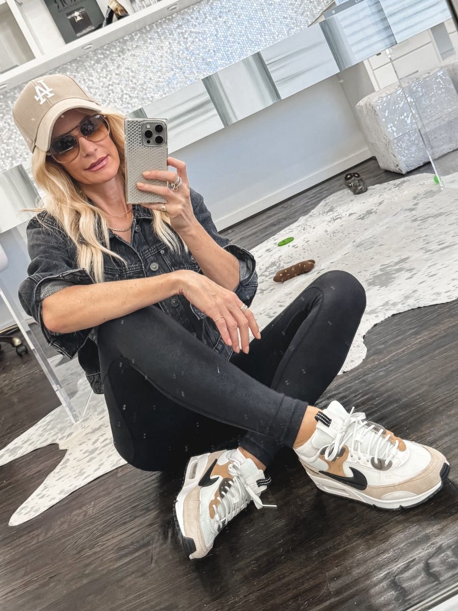 Dallas fashion blogger showcasing 10 stylish outfits from the Nordstrom Anniversary Sale including a athleisure look that includes Spanx faux leather leggings, nike sneakers and cropped denim jacket.