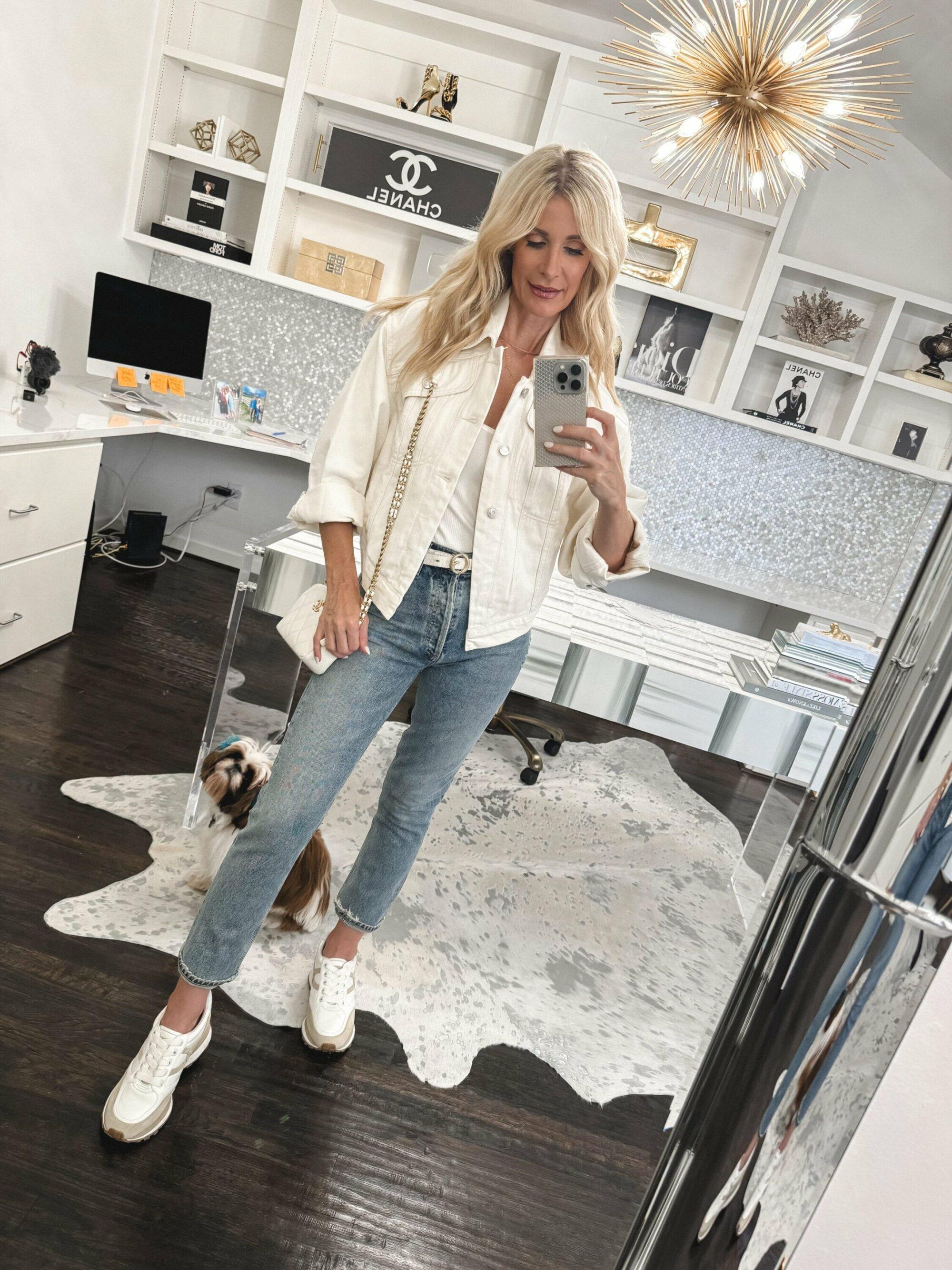 Dallas fashion influencer for women over 40 wearing Valentina sneakers from Veronica Beard with straight leg jeans and an ivory denim jacket as one of 2024's top 10 best sellers.