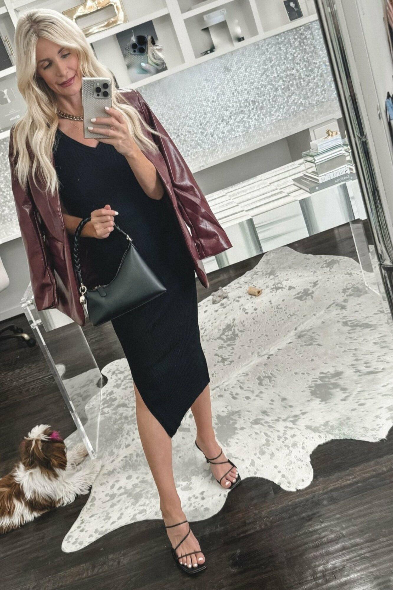 Dallas fashion stylist for women over 40 wearing a burgundy blazer with a black ribbed midi dress as a example of one of 5 under $100 fall dresses.