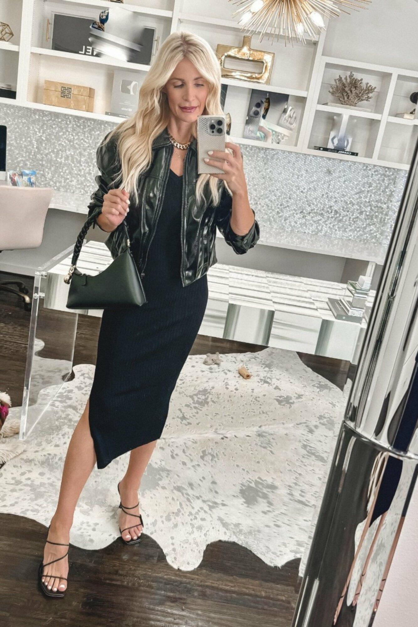 Dallas fashion blogger wearing a black knit midi dress with a shiny black moto jacket.