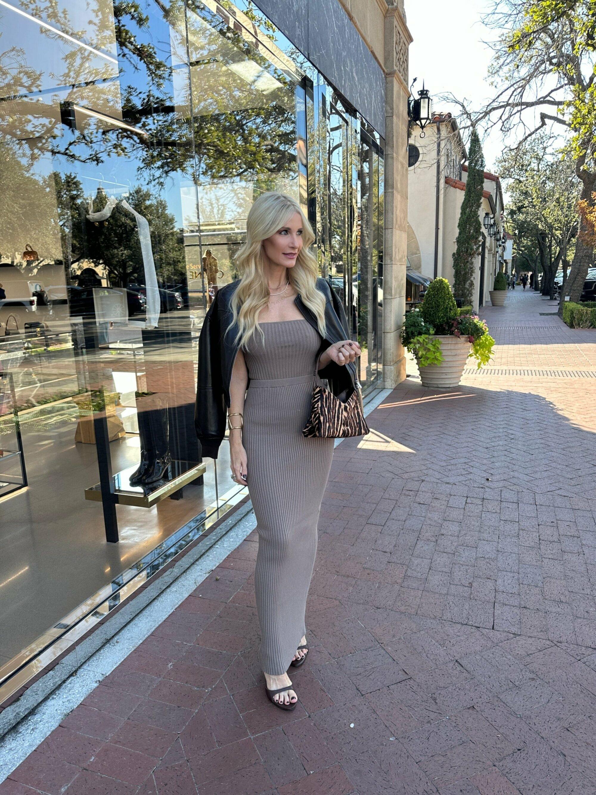 Over 40 fashion influencer wearing a calf hair handbag.