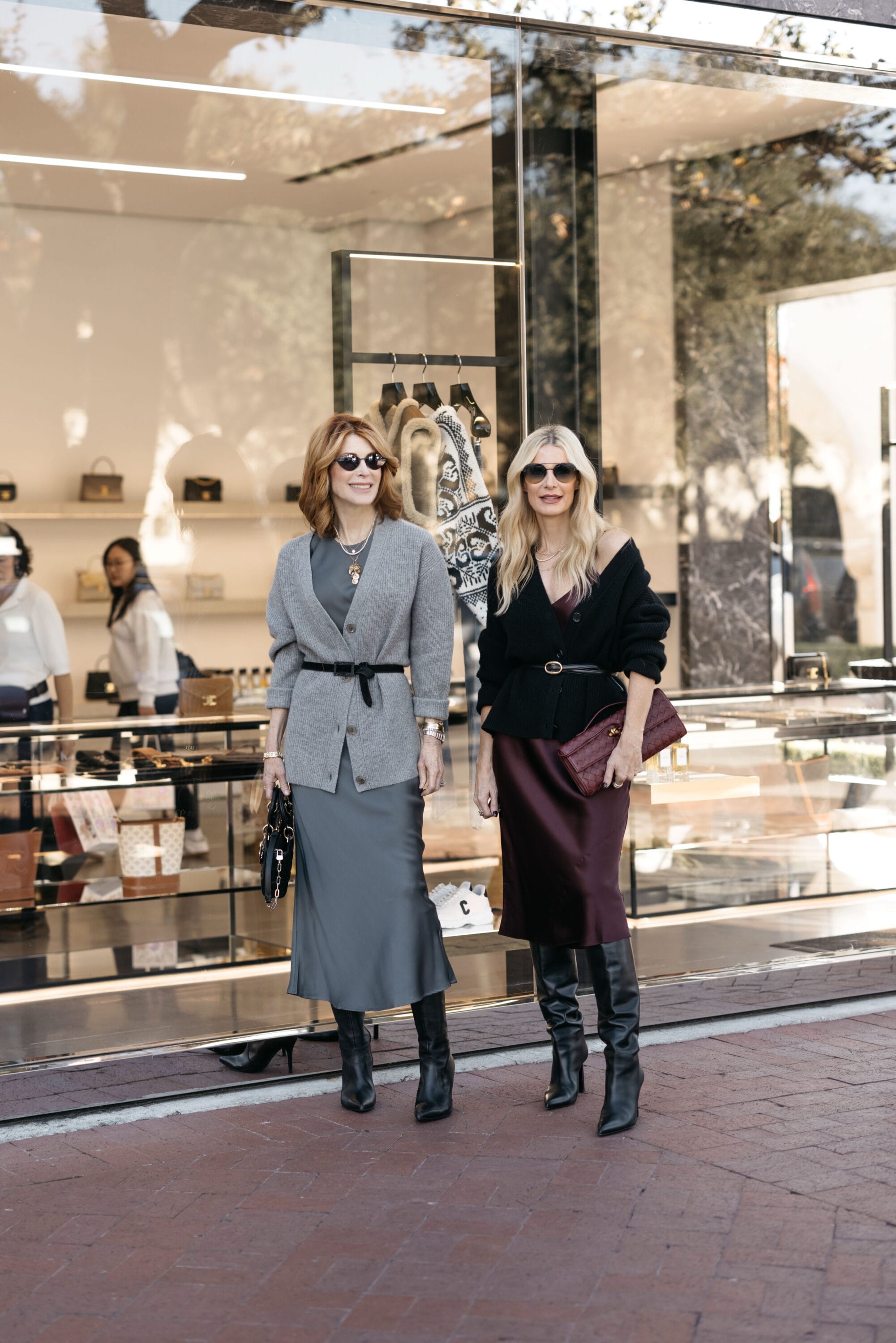 Dallas fashion bloggers for women over 40 wearing cashmere cardigans with silk slip dresses.
