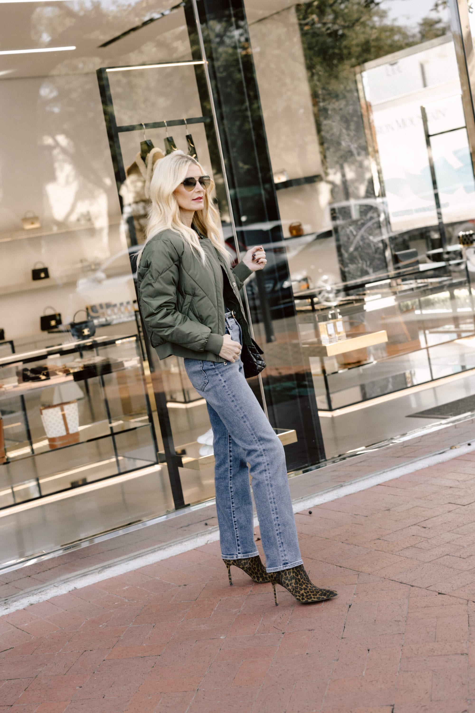 Dallas fashion blogger wearing leopard booties as one of the hottest 2025 shoe trends.
