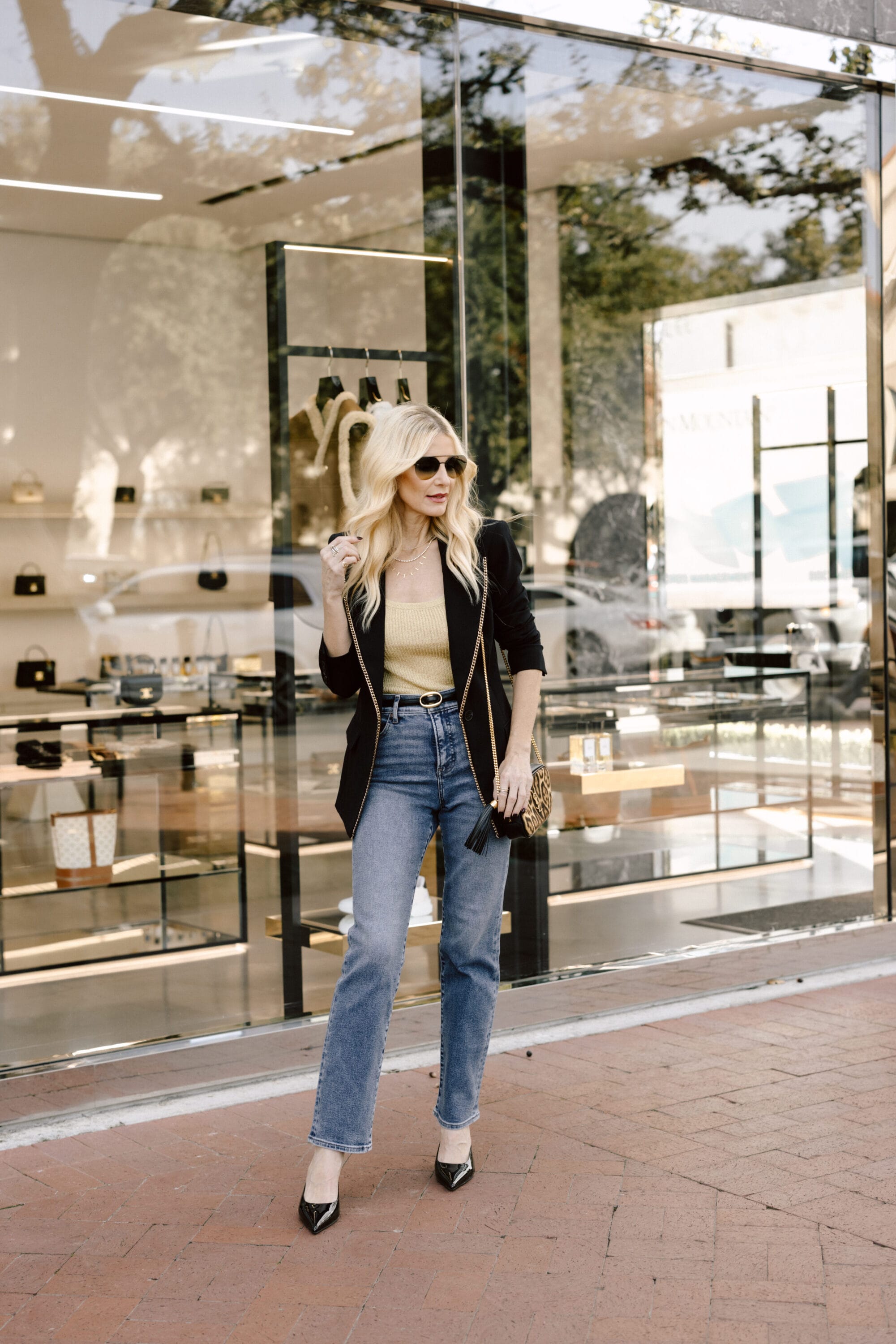 Dallas Fashion blogger wearing a gold tank with a gold trimmed blazer as one of 2025's hottest fashion trends.