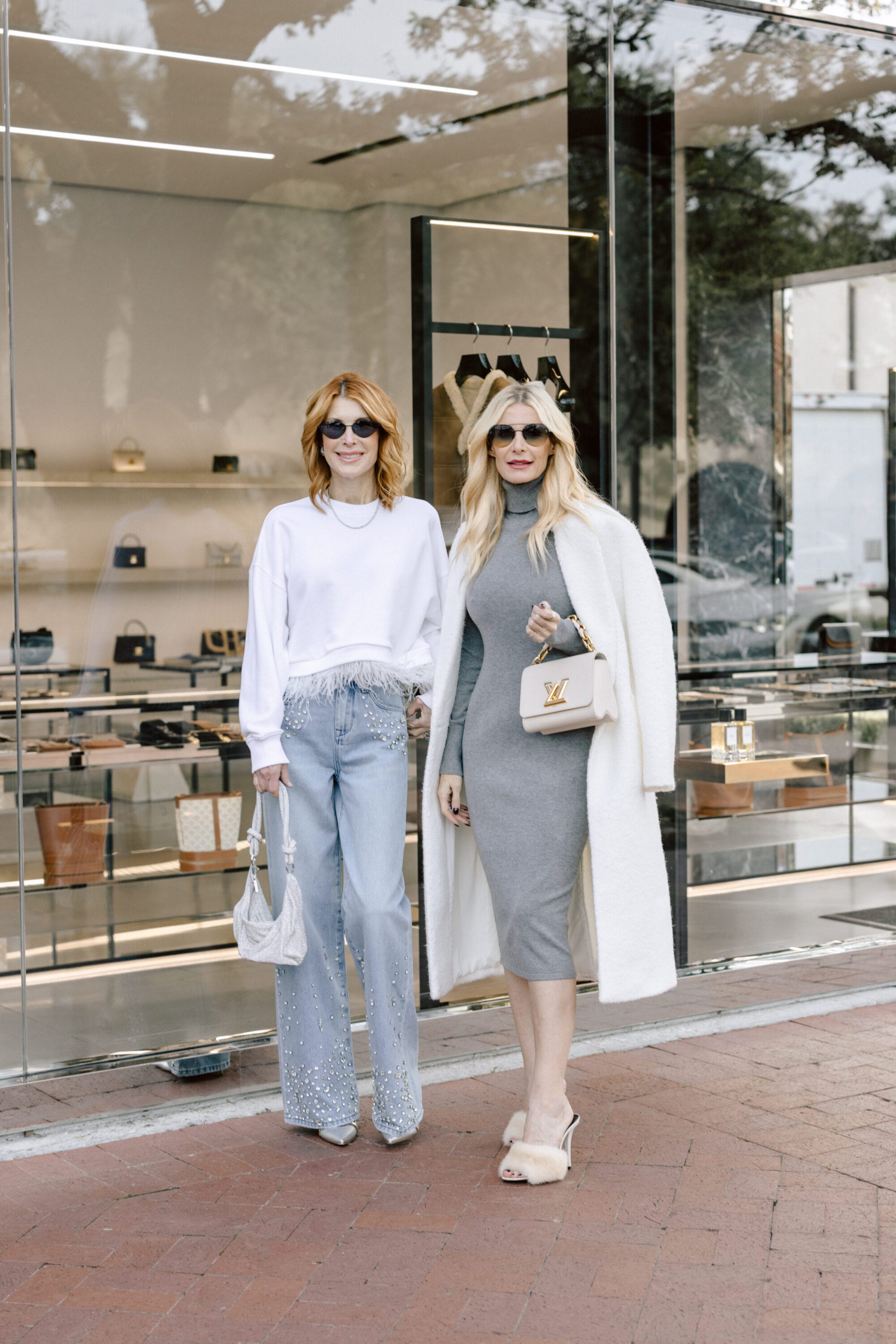 Over 40 fashion bloggers wearing wide leg jeans and a sweater dress as 2 of 2025's hottest fashion trends.