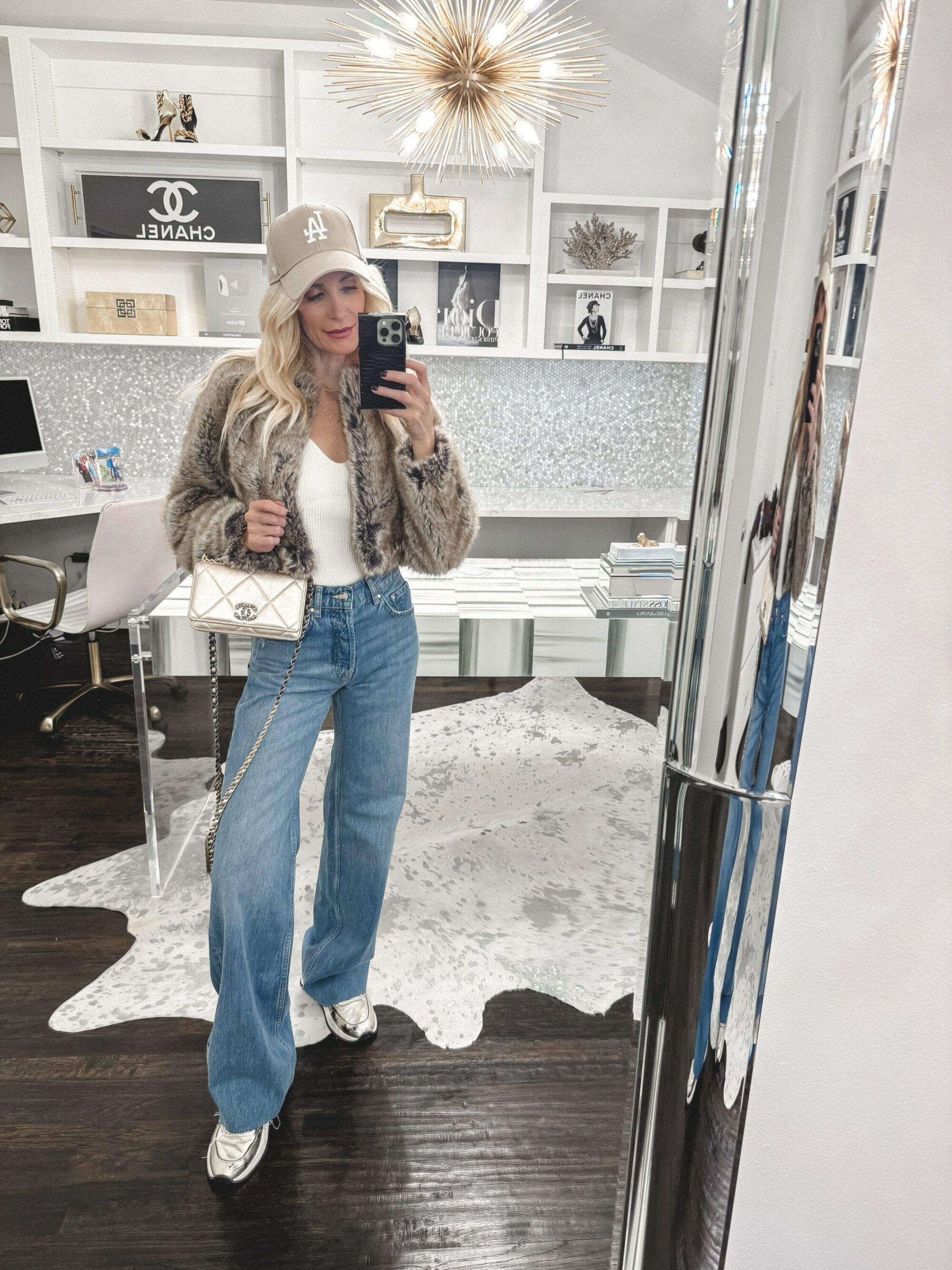 Over 40 Dallas fashion stylist wearing metallic sneakers with wide leg jeans and a faux fur jacket as one of the hottest 2025 shoe trends.