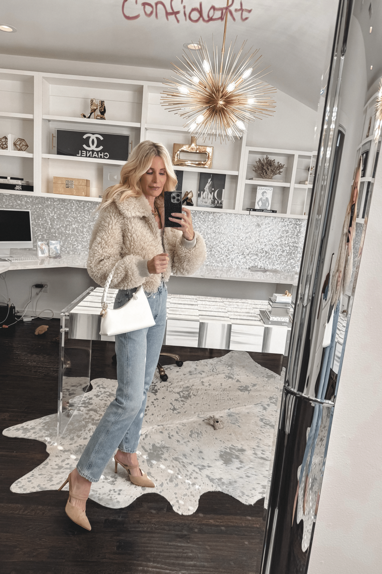 Over 40 Dallas fashion blogger wearing the most slimming pair of jeans EVER with a faux fur jacket and nude heels.