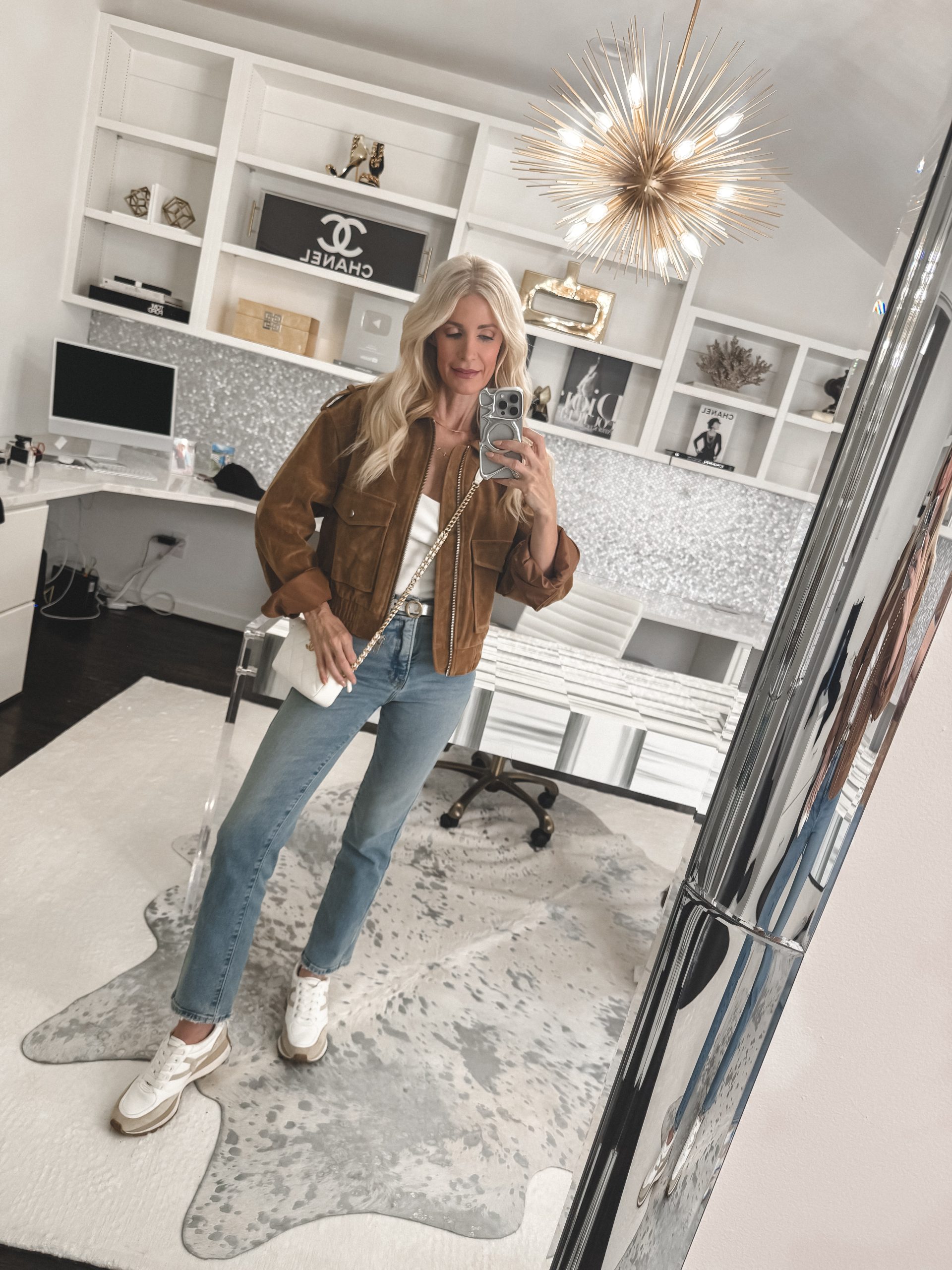 Over 40 fashion stylist wearing the best jeans for women over 50.