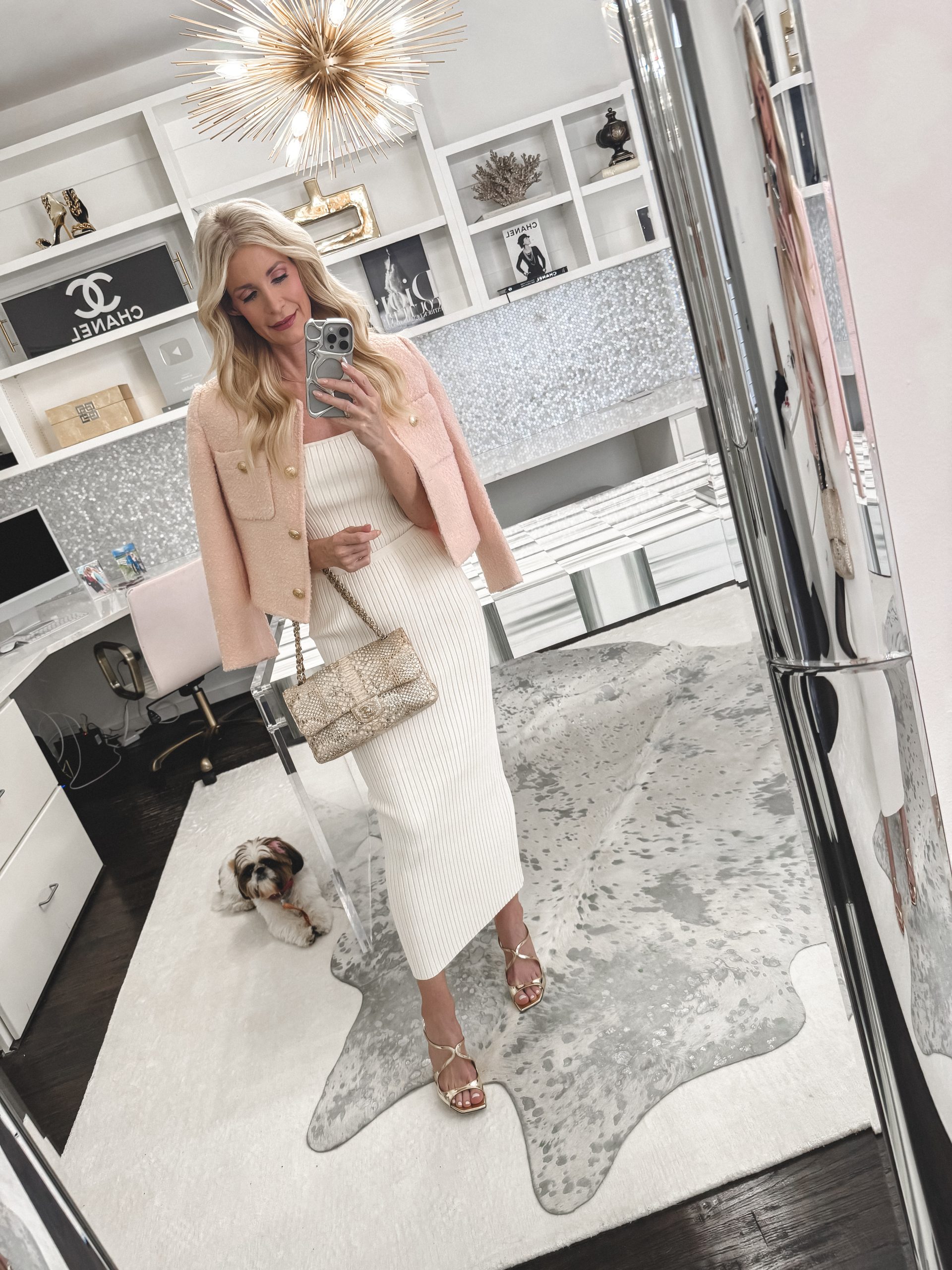 Dallas fashion influencer wearing a pink tweed jacket with an ivory skirt that is one of the most-loved items of April.