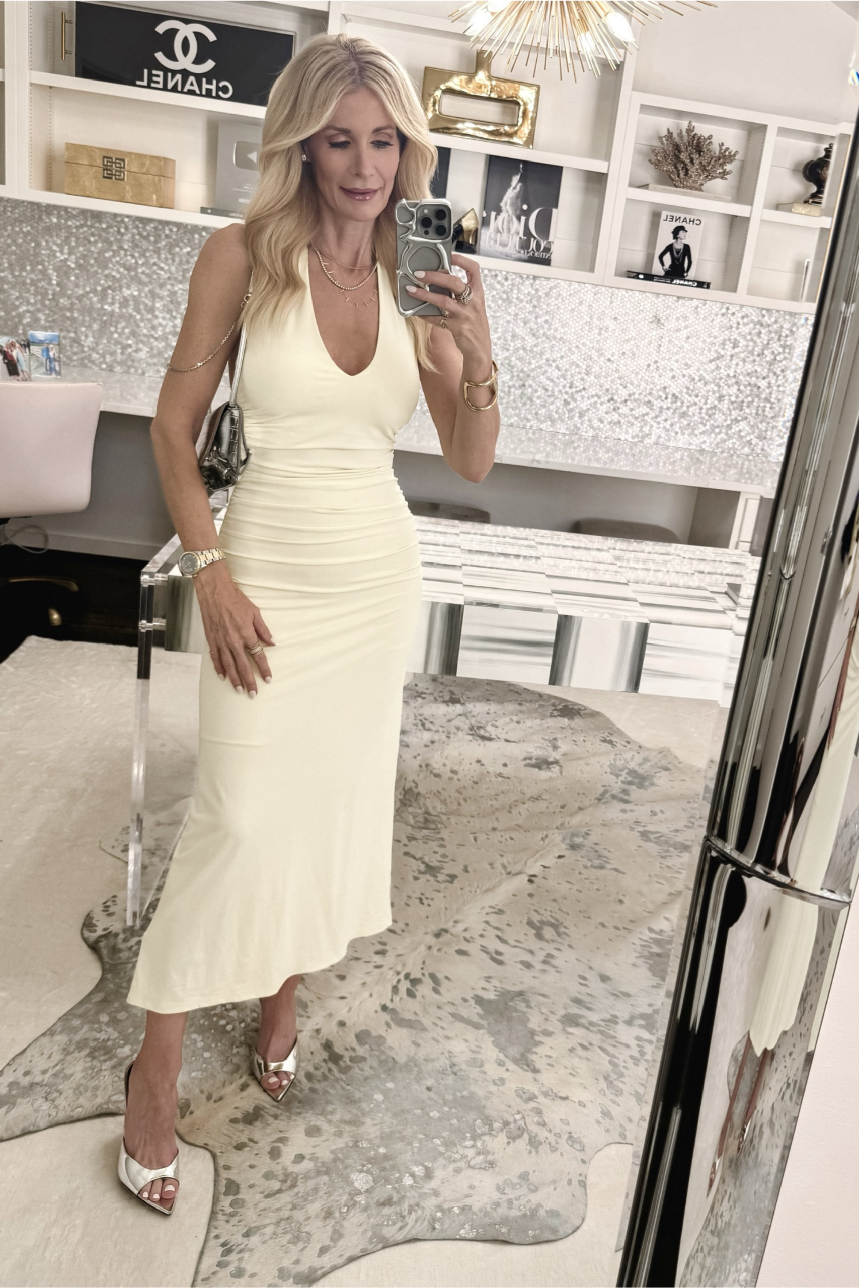Over 40 fashion influencer wearing a under $100 butter yellow midi dress as one of the top 5 2025 summer fashion trends