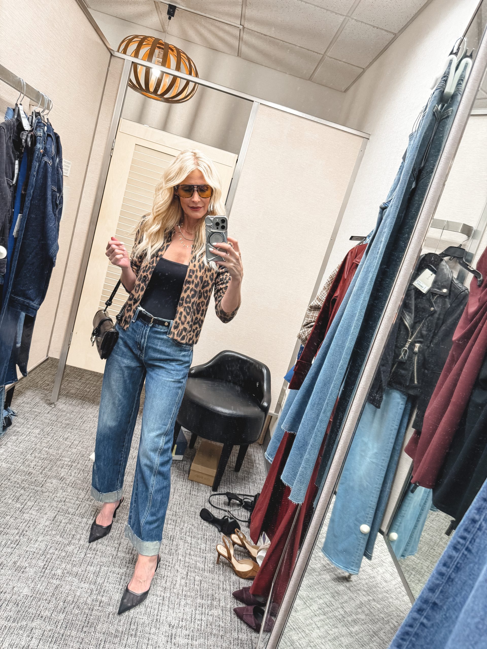 Over 40 fashion influencer wearing a leopard cardigan and Pistola jeans as one of her fashion-forward looks from the Nordstrom Anniversary Sale.