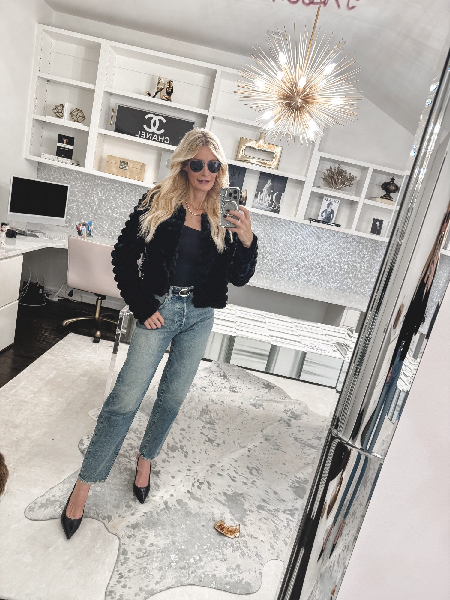 Dallas fashion blogger wearing a black faux fur jacket with loose fit jeans and black heels as part of the ultimate Fall Capsule Wardrobe 2025.
