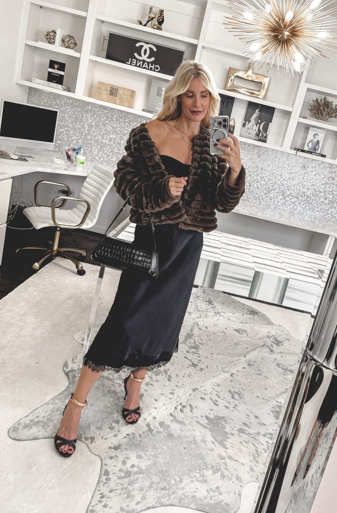 Dallas fashion blogger wearing a silk lace trimmed midi skirt with a faux fur jacket as one of 2025's Viral Fall Fashion Trends.