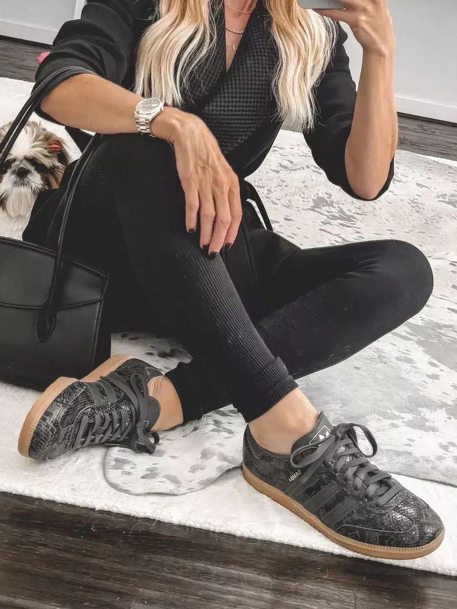 Over 40 fashion stylist wearing snakeskin samba sneakers as one of the most comfortable sneakers for women over 40.