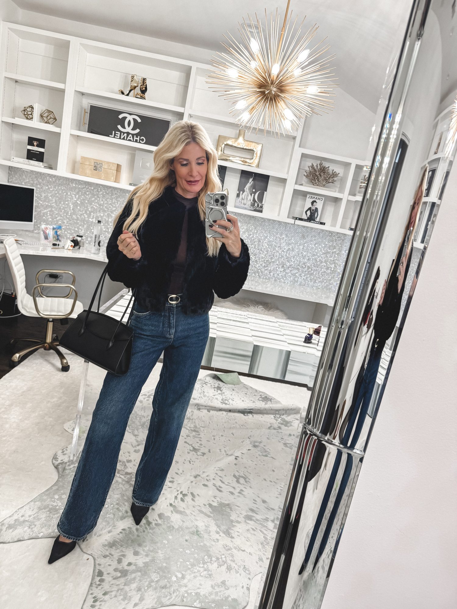 Dallas fashion blogger wearing wide leg jeans with a cropped faux fur jacket.