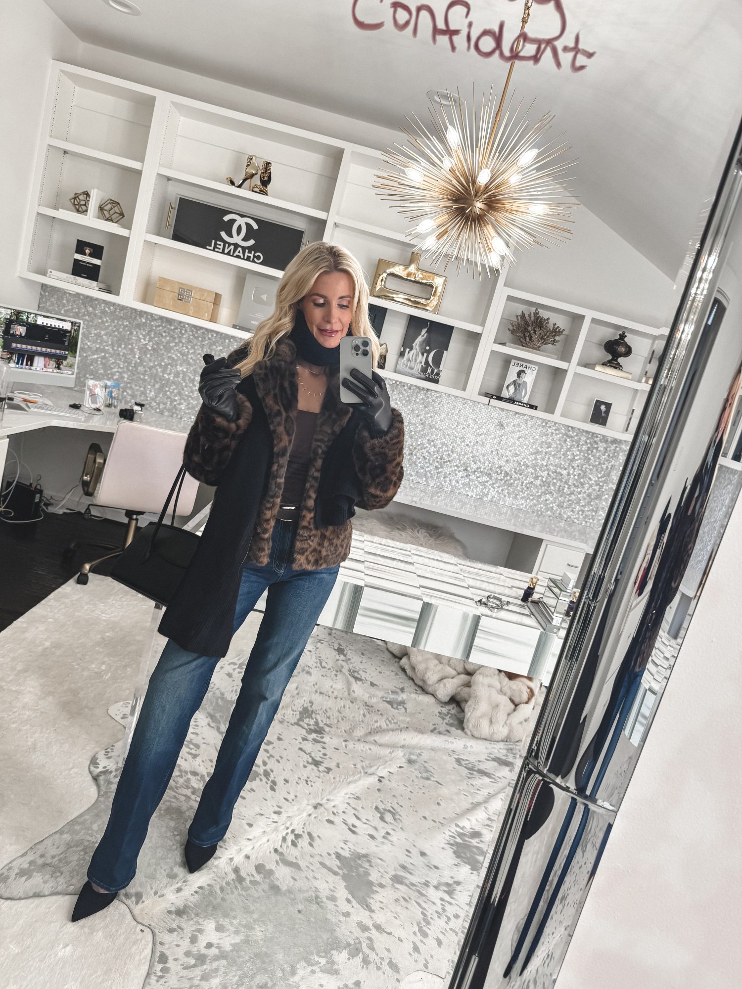 stylist for over 40 women wearing pointed toe mules with wide leg jeans.