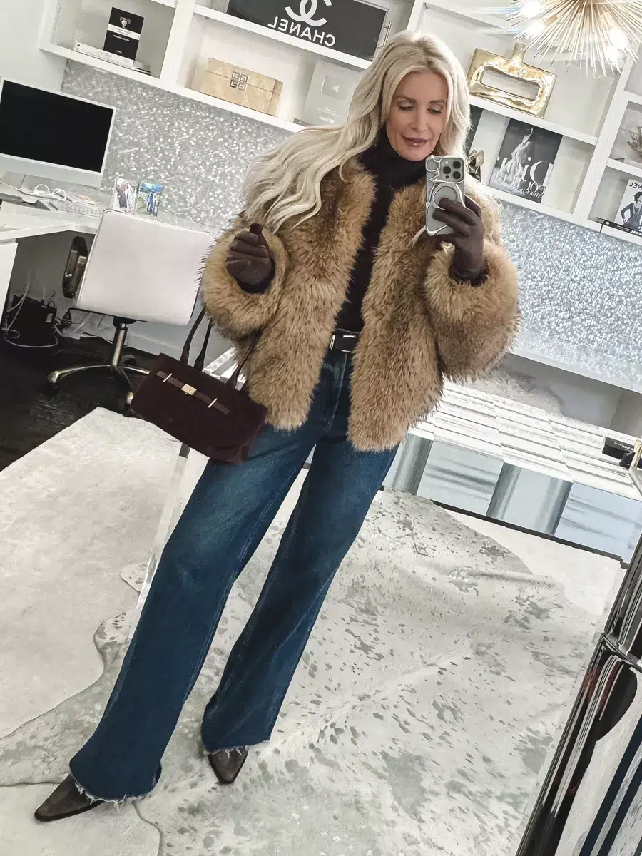 Dallas fashion blogger over 40 wearing wide leg jeans with a cropped fitted reversible bomber jacket that prevents the marshmallow effect which is one of 7 Winter style mistakes.