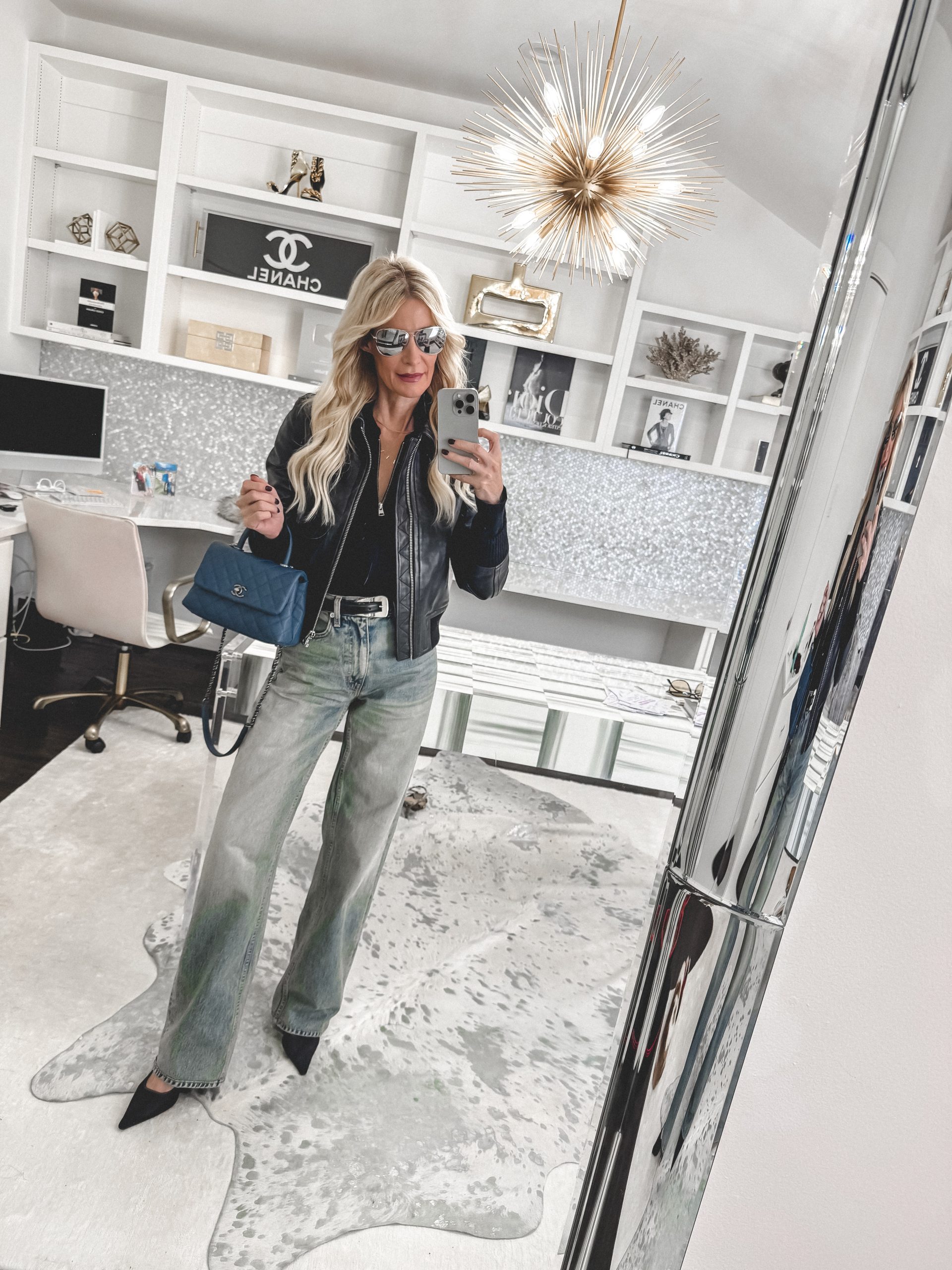 Over 40 stylist wearing light grey jeans and pointed kitten heels instead of rounded toe flats.