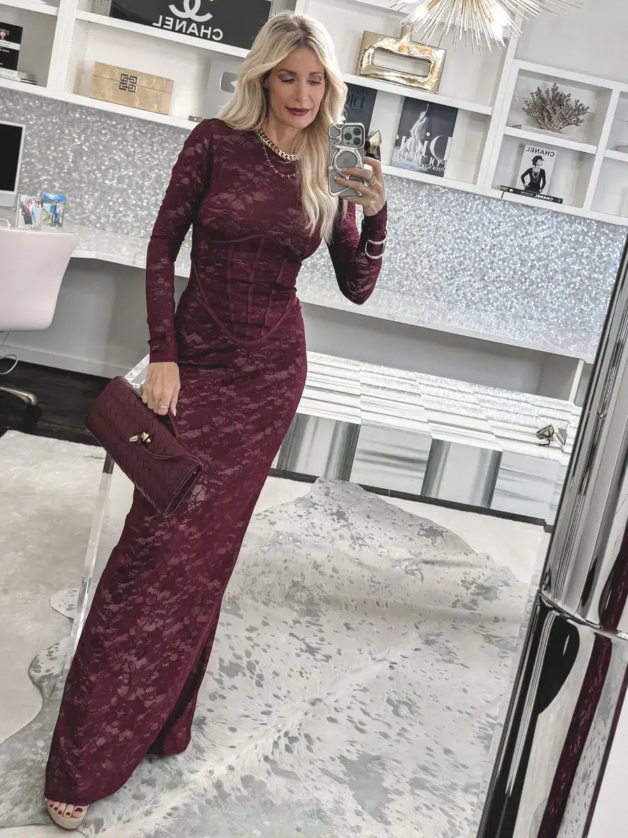 Dallas fashion stylist wearing a burgundy lace maxi dress with a matching handbag as one of the Top Color Trends of 2026.