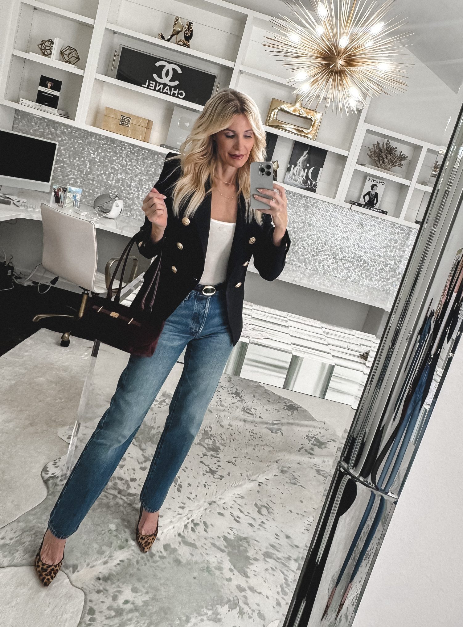 Dallas fashion blogger for women over 40 wearing a classic blazer and leopard heels with cigarette jeans as an example of how to style wardrobe staples.