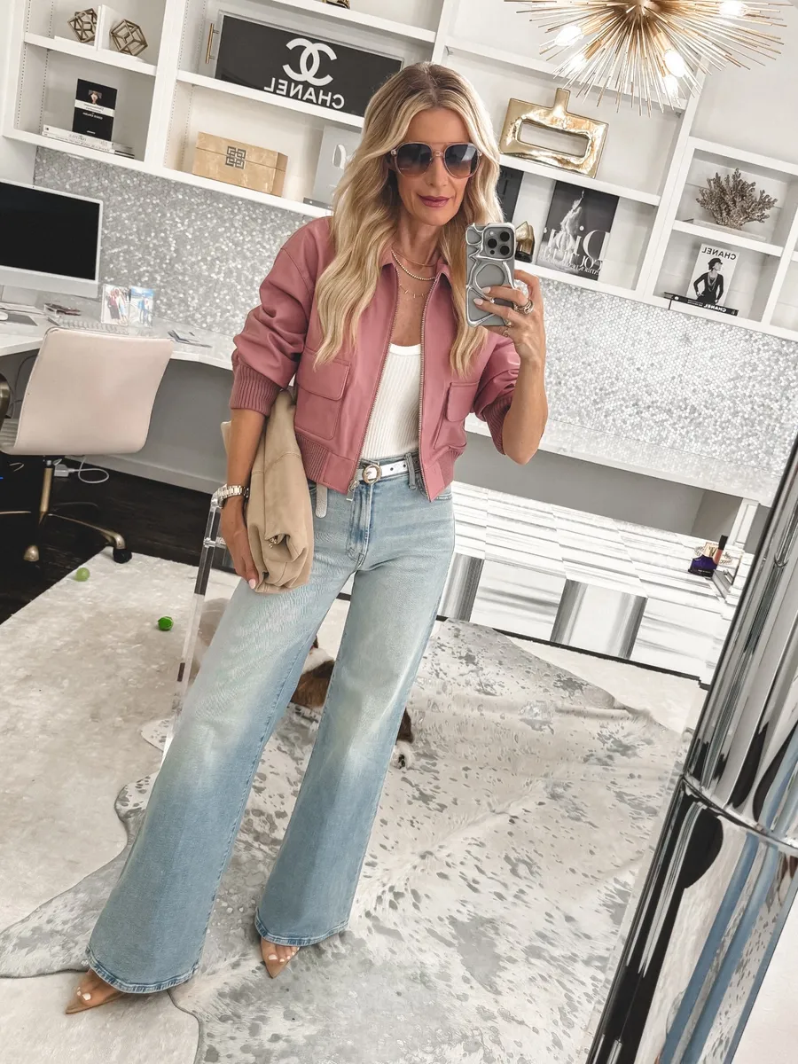 Dallas fashion blogger over 40 wearing wide leg denim with a pink bomber jacket with chic mesh heels with are an alternative to Shoe Trends Out of Style 2026.