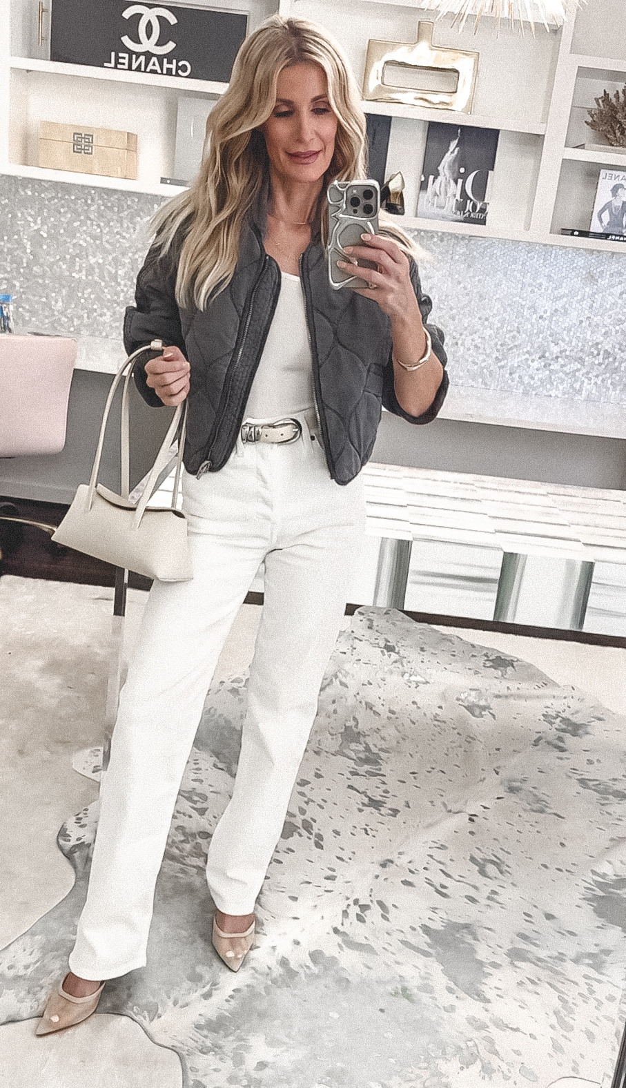 Fashion stylist for women over 40 wearing ivory denim with mesh heels and a white tank as one of 8 must have summer items.