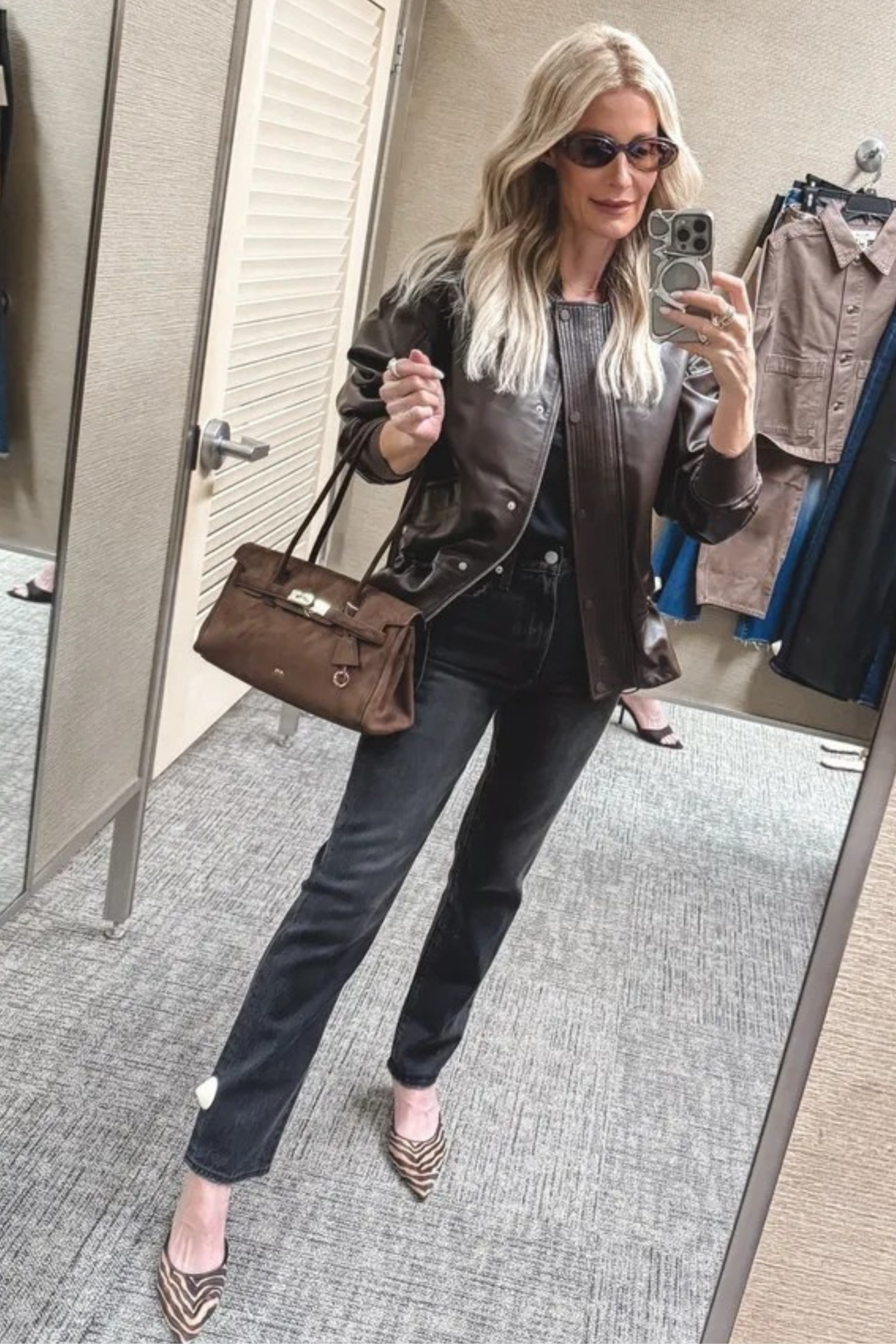 Over 40 Dallas fashion influencer wearing black jeans and leather jacket as part of 10 Nordstrom Anniversary Sale Outfits..