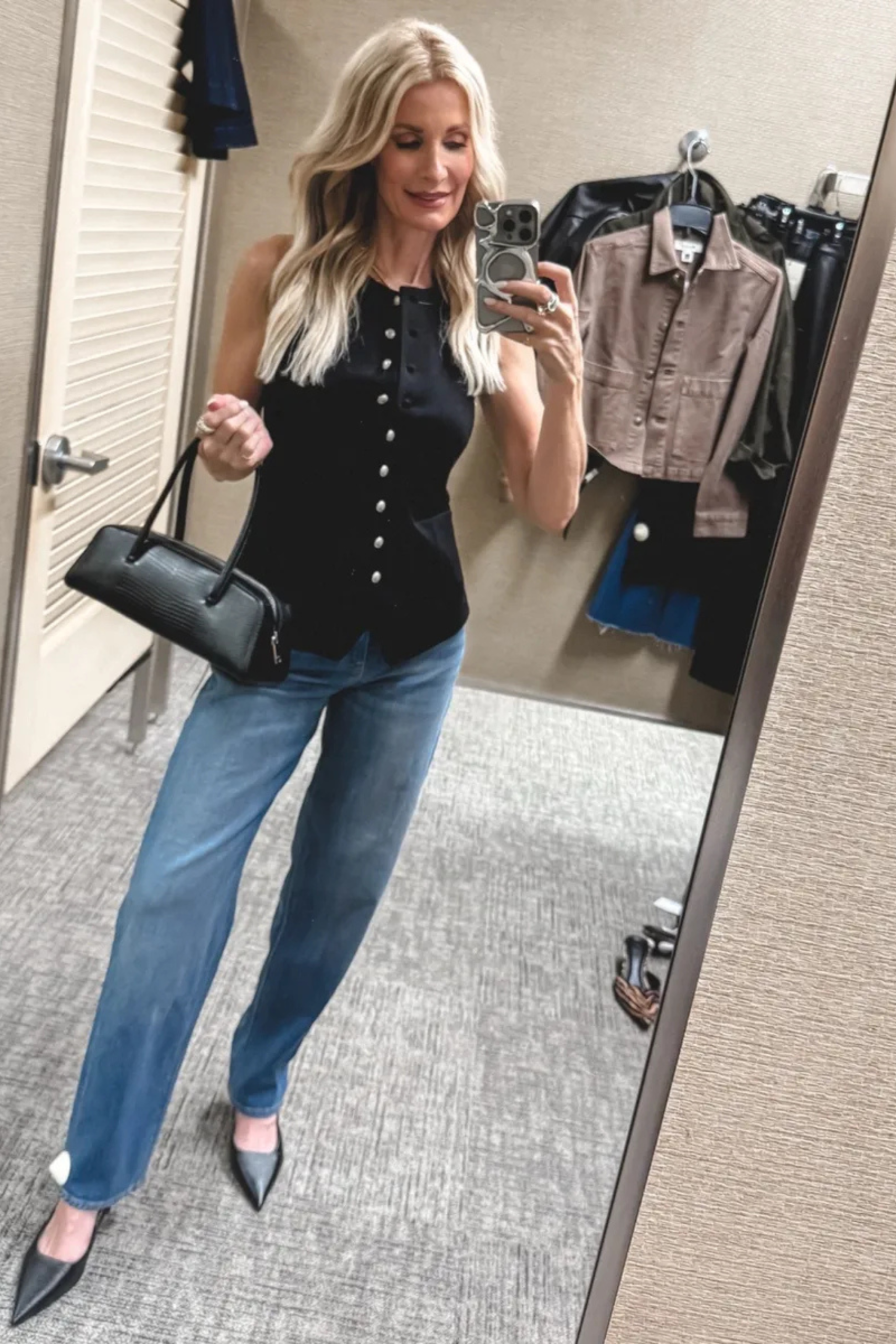 Fashion blogger for women over 40 wearing a ponte vest with barrel leg jeans.