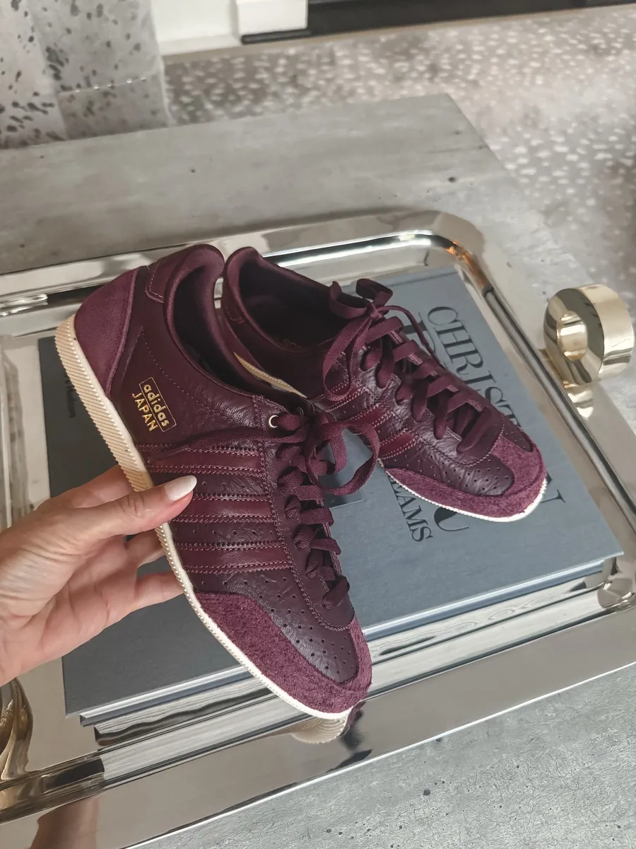 Close up shot of burgundy sneakers that are on the list of What I actually bought From the NSALE.