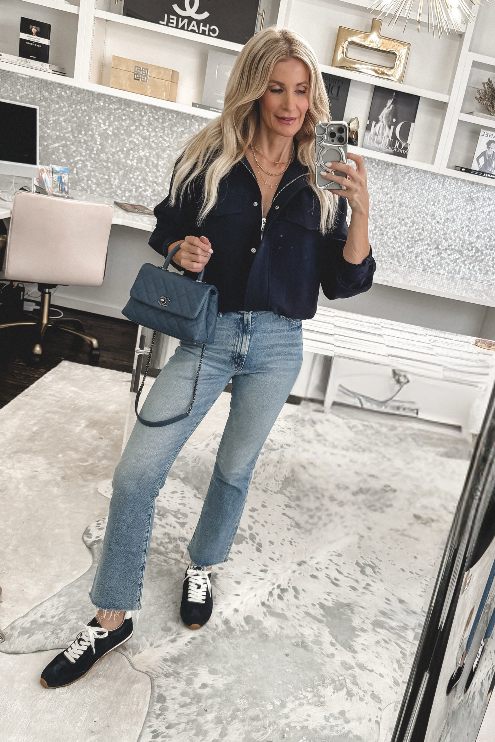 Fashion influencer for women over 40 wearing navy sneakers as one of 10 NSALE Finds Still in Stock.