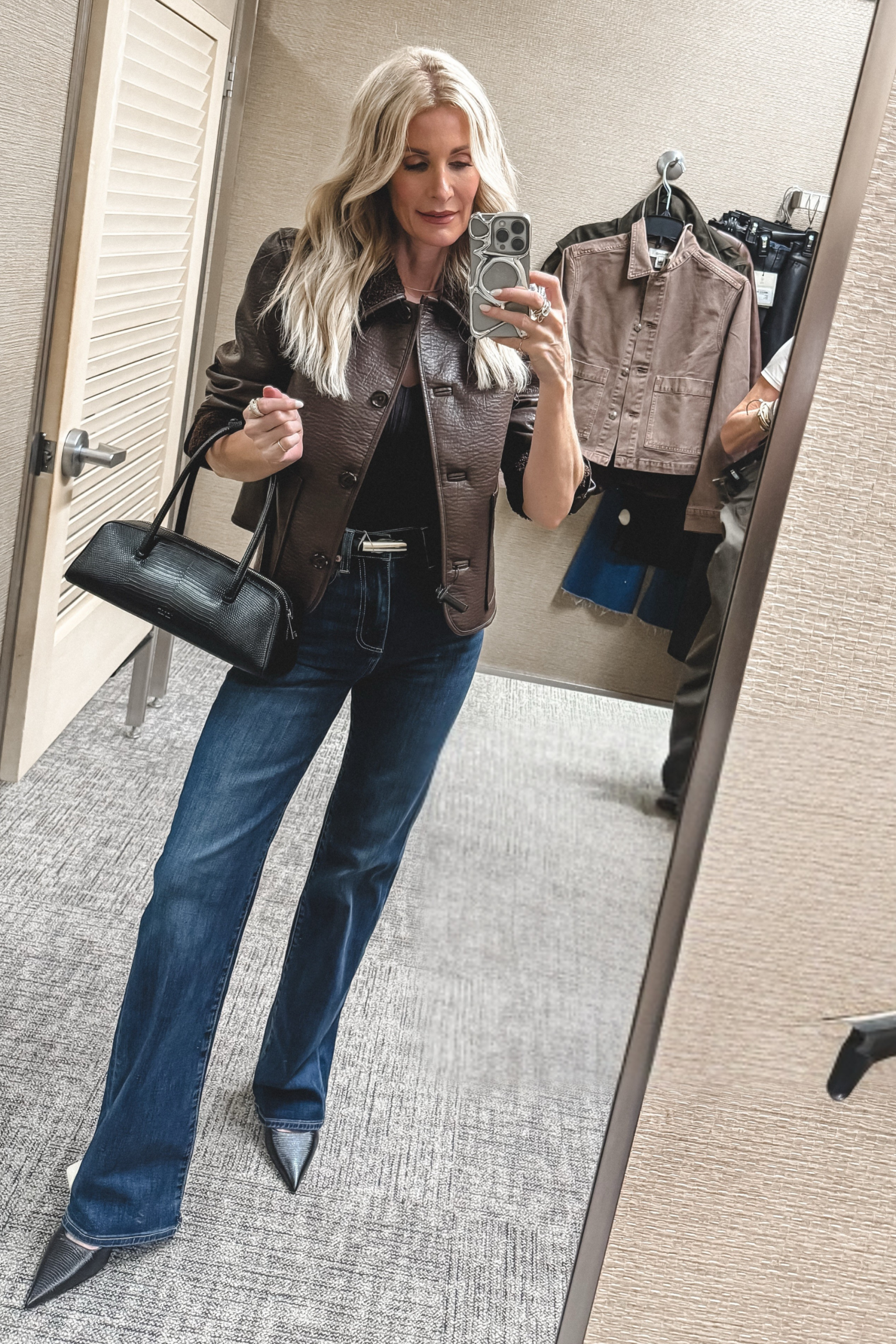 Dallas fashion blogger over 40 wearing a fur lined leather jacket with baby flare jeans as one of 10 NSALE Finds Still in Stock.
