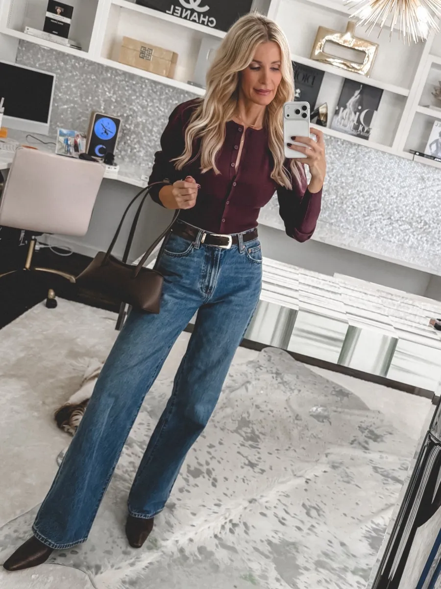 Dallas fashion blogger over 40 wearing snake print booties as one of the hottest 2026 fall boot trends.