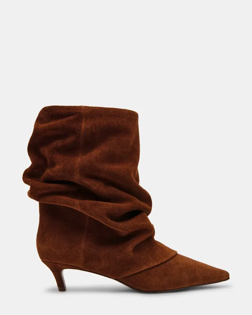 A pair of brown suede slouchy booties that is one of the hottest 2026 fall boot trends.